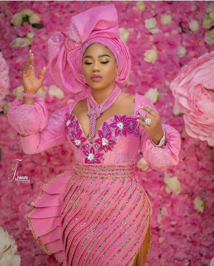 Glam Look Of The Day: Toyin Lawani  Stuns in a Pink Aso-oke