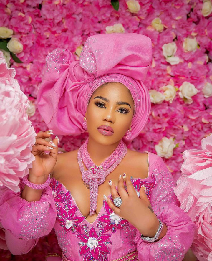 Glam Look Of The Day: Toyin Lawani  Stuns in a Pink Aso-oke