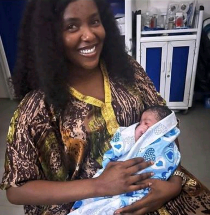 Biola Bayo and her baby
